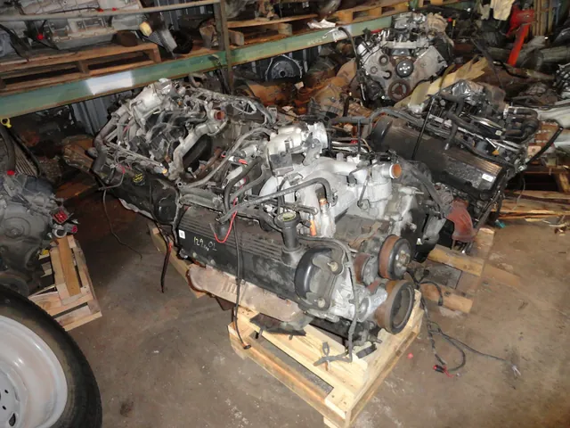 Pulled engines and transmissions on pallets inside the parts warehouse